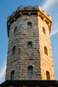 Low angle view of clock tower against sky