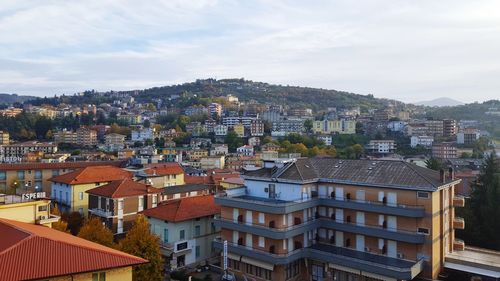 Aerial view of town against sky