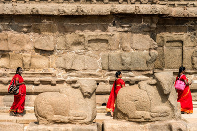 Group of people against wall