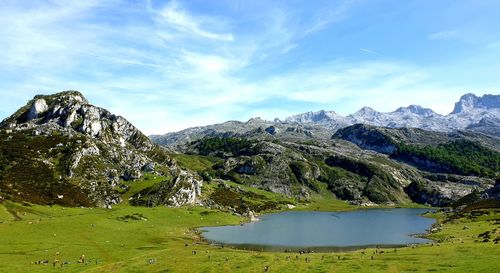 Scenic view of lake and mountains against sky