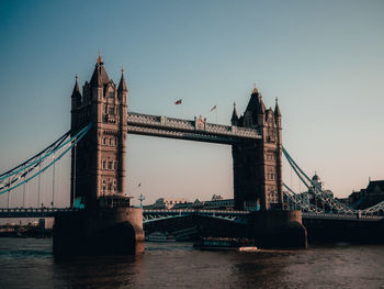 View of bridge over river in city