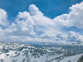 Scenic view of snowcapped mountains against sky