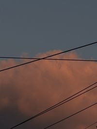 Low angle view of cables against sky