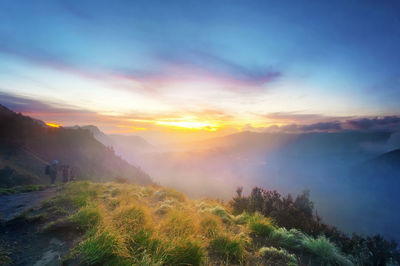 Scenic view of landscape against sky during sunset