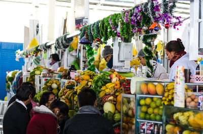 Group of people at market stall