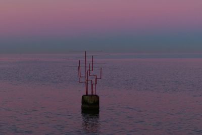 Scenic view of sea against sky at sunset