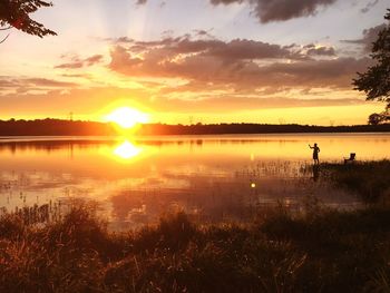 Scenic view of sunset over lake