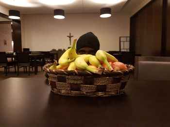 Portrait of fruits in basket on table