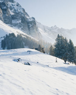 Scenic view of snowcapped mountains against clear sky