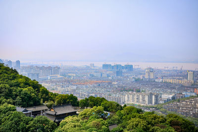High angle view of buildings in city against clear sky