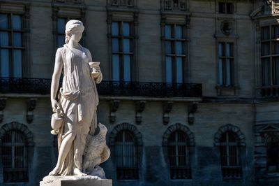 Low angle view of statue against building