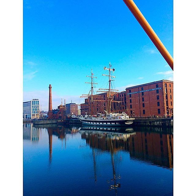 water, architecture, waterfront, built structure, reflection, clear sky, building exterior, blue, moored, nautical vessel, harbor, transfer print, transportation, river, boat, auto post production filter, copy space, city, day, sky