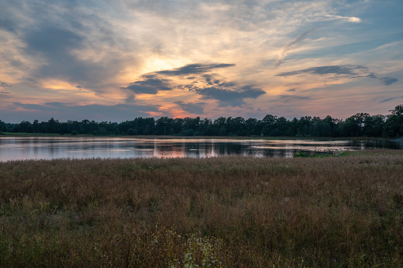 SCENIC VIEW OF SUNSET OVER LAKE