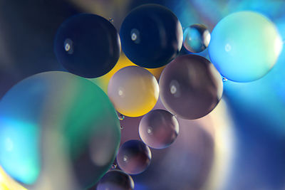 Close-up of balloons against blue sky