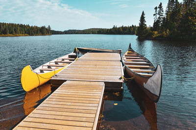 Pier over lake against sky