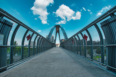 View of footbridge against sky