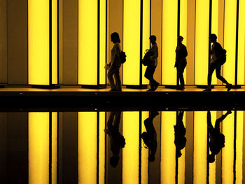 Silhouette men standing against clear sky