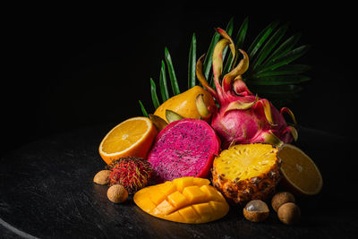 Close-up of fruits against black background