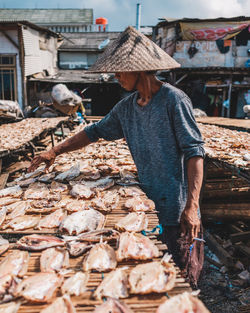 Man working at market stall