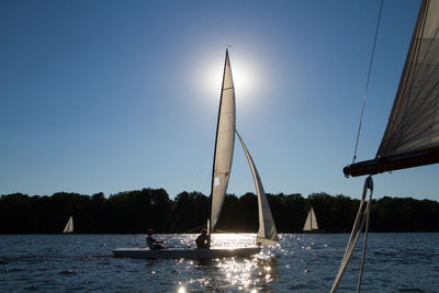 Sailboats in river