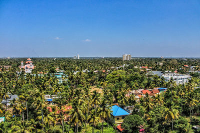 High angle view of trees and buildings against sky