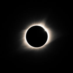 Low angle view of silhouette moon against sky at night