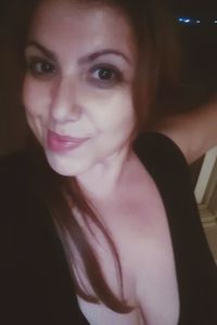 Close-up portrait of smiling young woman