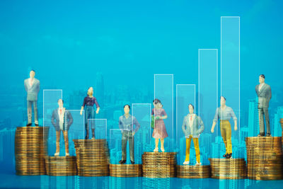 Digital composite image of people with blue sky