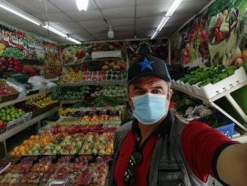 Portrait of man standing in store