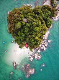 High angle view of rocks by sea