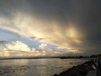 Scenic view of sea against sky at sunset