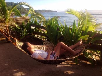 People relaxing on beach