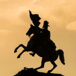 Low angle view of statue against sky