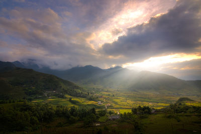 Scenic view of field against sky during sunset