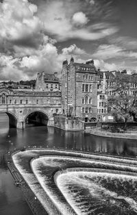 View of bridge over river in city