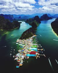 High angle view of boats in sea against sky