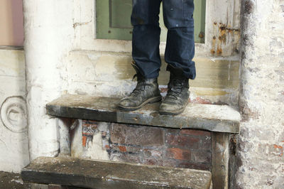 Low section of man standing on floor