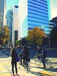 People riding bicycle on city street