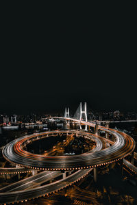 High angle view of illuminated buildings in city at night