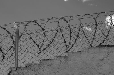 Chainlink fence against sky