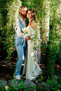 Young couple kissing on flower