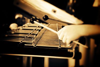 Close-up of person playing piano