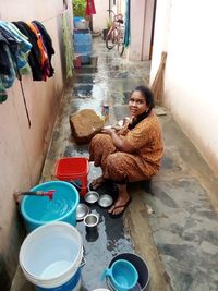 High angle view of mother and daughter sitting at home