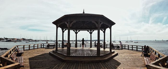 Gazebo at beach against sky