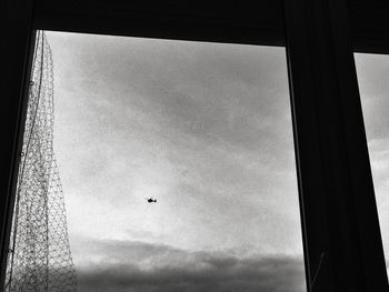 Low angle view of airplane flying in sky