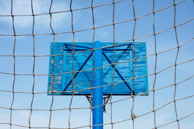 Street basketball hoop and blue sky