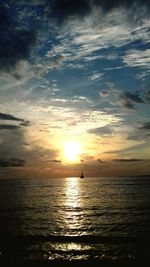 Scenic view of sea against sky at sunset