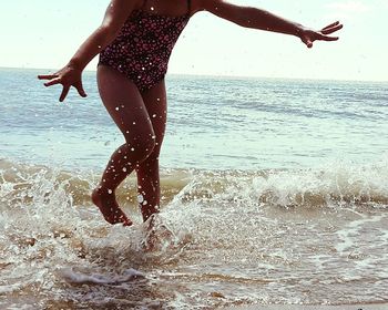 Low section of woman on beach