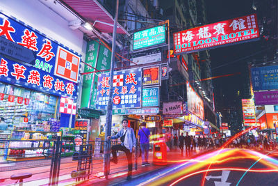 Illuminated city street at night
