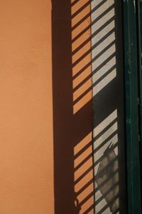 Shadow of window on building wall during sunny day